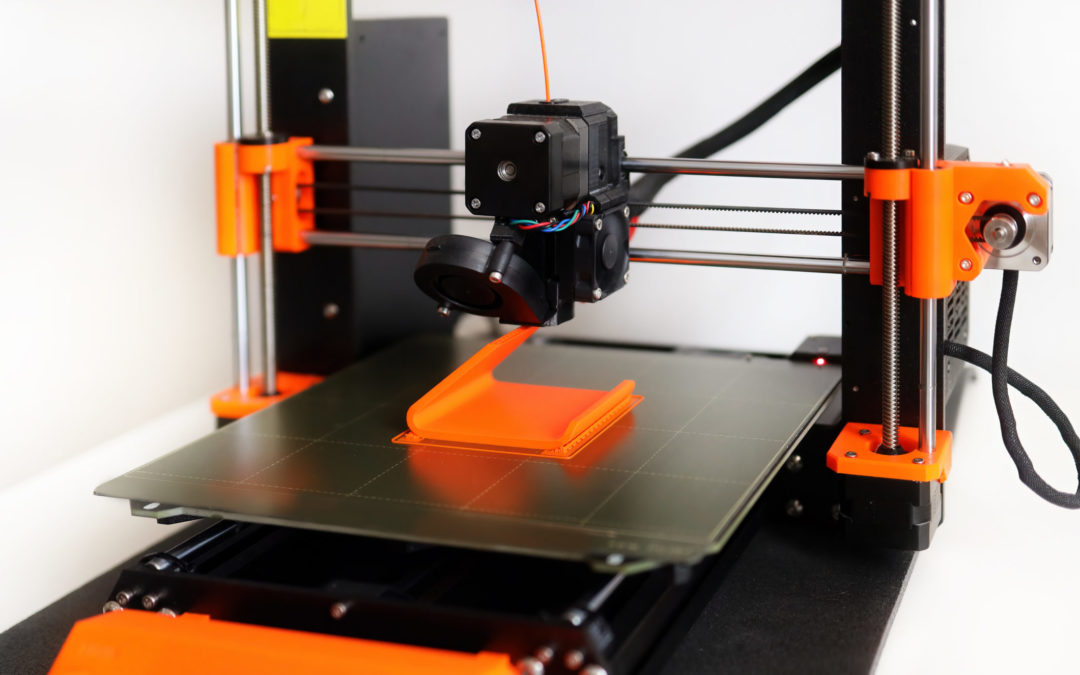 FDM 3D Printer printing orange 3D object.