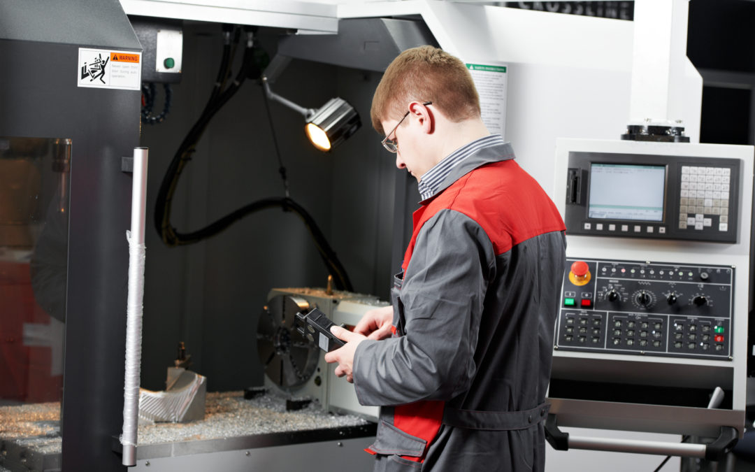 Engineer working on CNC Milling Machine